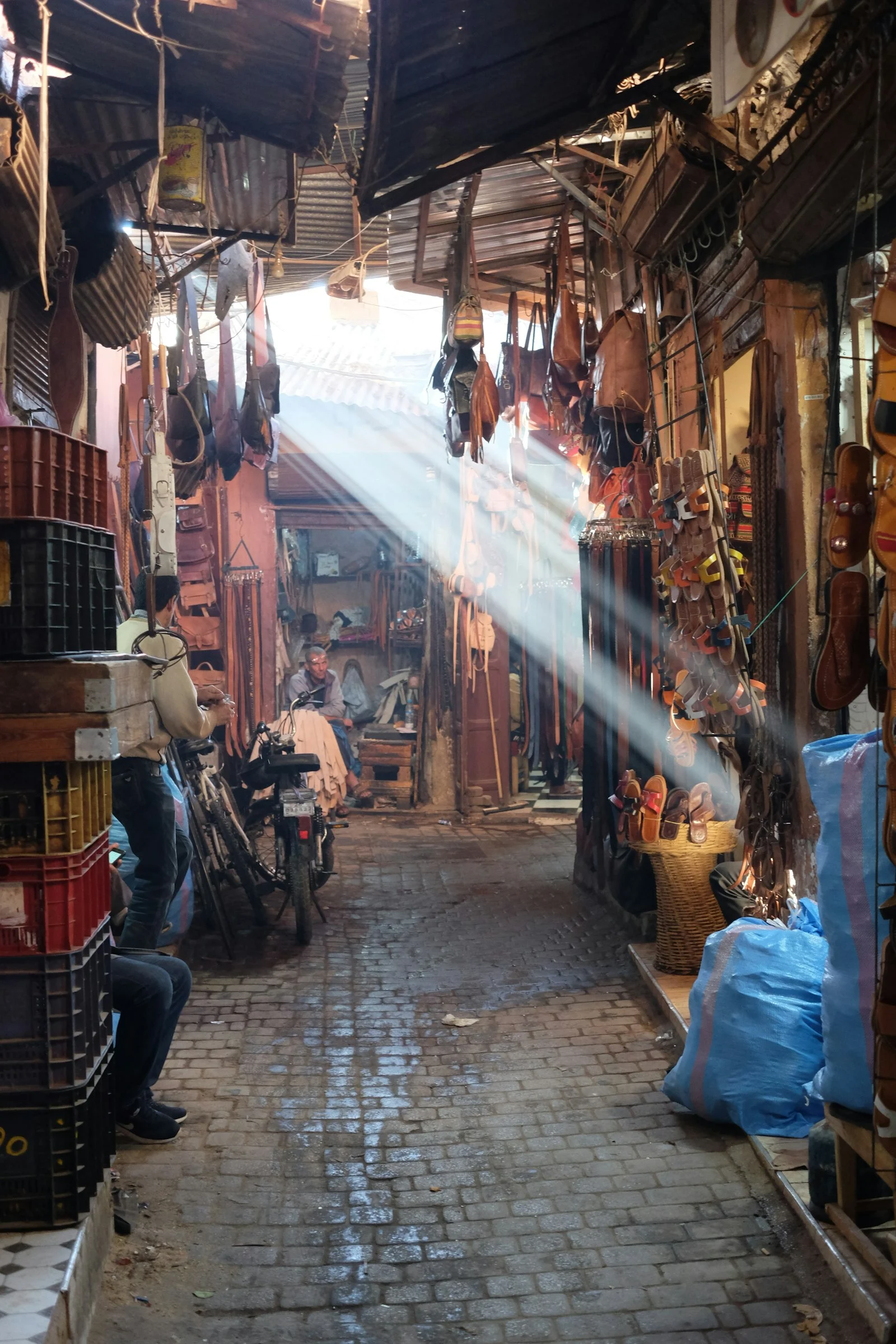 Sunbeams in a covered souk of the Marrakech medina Sunbeams in a covered souk of the Marrakech medina