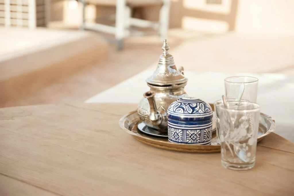 Silver teapot and tea glasses on a tray