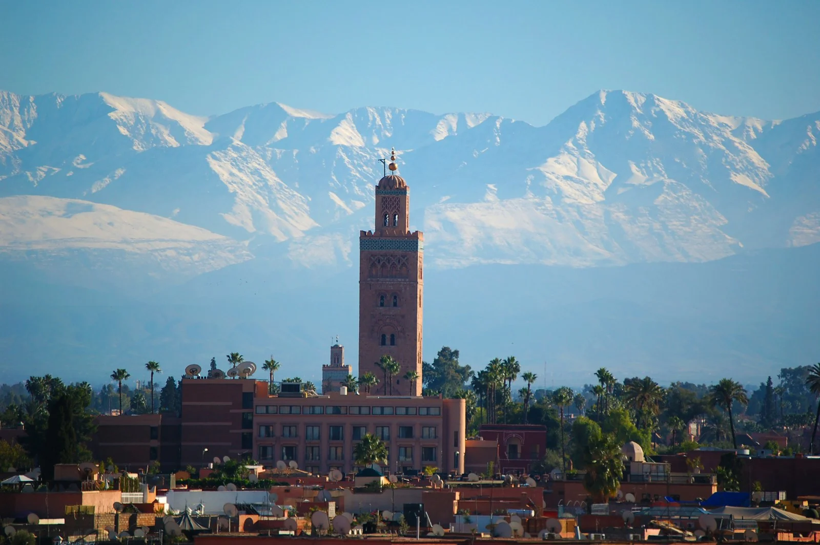 Koutoubia minaret with the snow-capped High Atlas behind